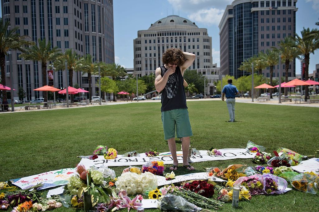 Mike Harrett visits a makeshift memorial June 13 outside the Dr. Phillips Center for the Performing Arts for the mass shooting victims at the Pulse nightclub in Orlando, Florida. 
