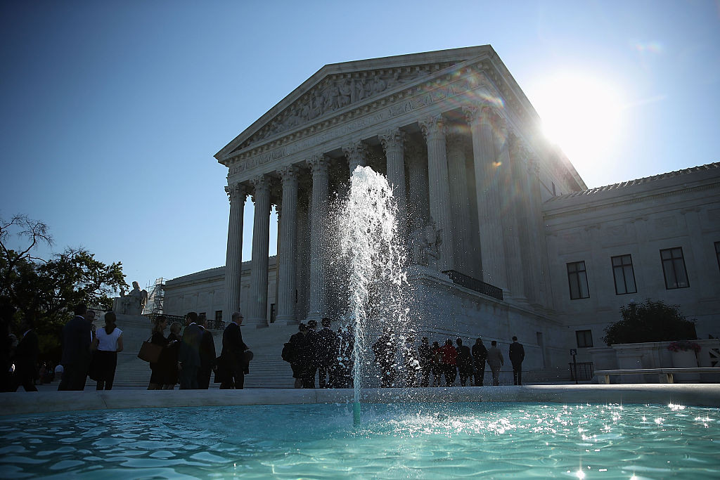 People wait in line to enter the U.S. Supreme Court building June 20, 2016 in Washington, DC. 