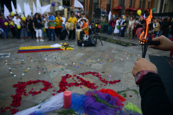 Colombians celebrate at Botero square in Medellin, Antioquia department, after the signing of the ceasefire between the Government and the FARC guerrillas in Havana, on June 23.       
