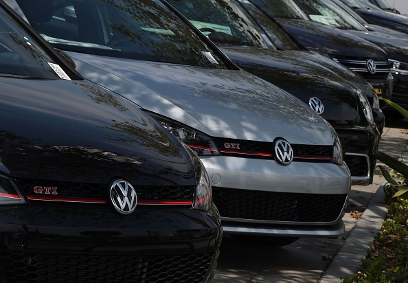 Volkswagen cars at a dealership in Los Angeles, California on June 28. 
Volkswagen has agreed to pay out $14.7 billion in a settlement with US authorities and car owners over its emissions-cheating diesel-powered cars.