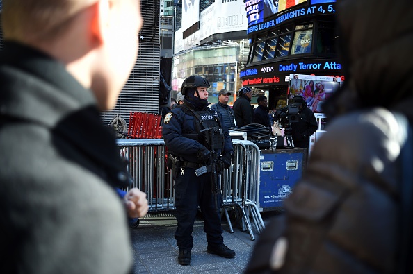 A New York Police Department (NYPD) officer patrols in Times Square on March 22 in New York. New York and Washington stepped up security in the wake of the attacks in Brussels on March 22, deploying counter-terrorism reinforcements and the National Guard to airports and stations, officials said.