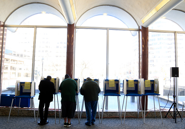 Voters take to the polls April 5 at Milwaukee City Hall in Milwaukee, Wisconsin.  A federal judge ordered the state last week to rewrite its voter ID rules.