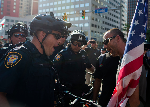 A protester and a police officer confront each other during a protest outside the Republican National Convention in Cleveland, Ohio on July 19.