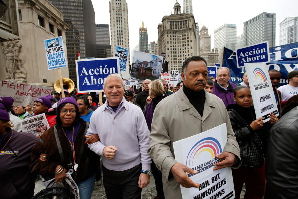 Andy Stern (L), then president of the SEIU leads a demonstration for bank reform with Jesse Jackson (R), president and founder of the Rainbow PUSH Coalition, in October 2009 in Chicago, Illinois.