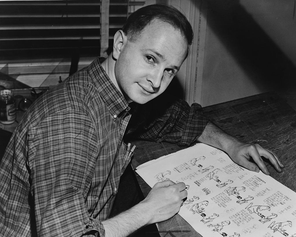  Jules Feiffer is shown  in 1958 with proof sheets from Sick Sick Sick, his first book.