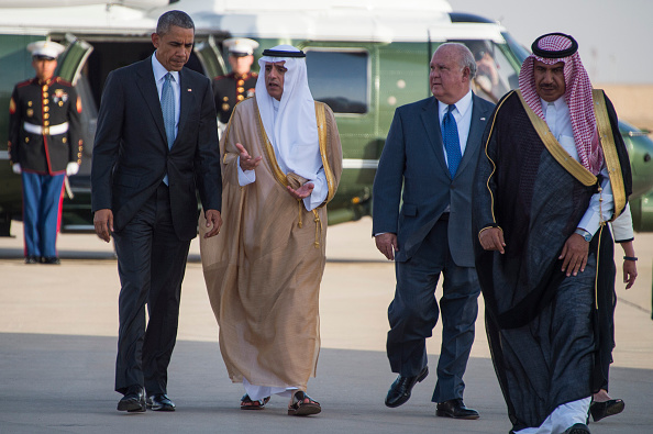 U.S. President Barack Obama (L) talks with Saudi Arabian Foreign Minister Adel al-Jubeir (2nd L) and US Ambassador to Saudi Arabia T.H. Joseph Westphal (2nd R) as he departs King Khalid International Airport in Riyadh on April 21.