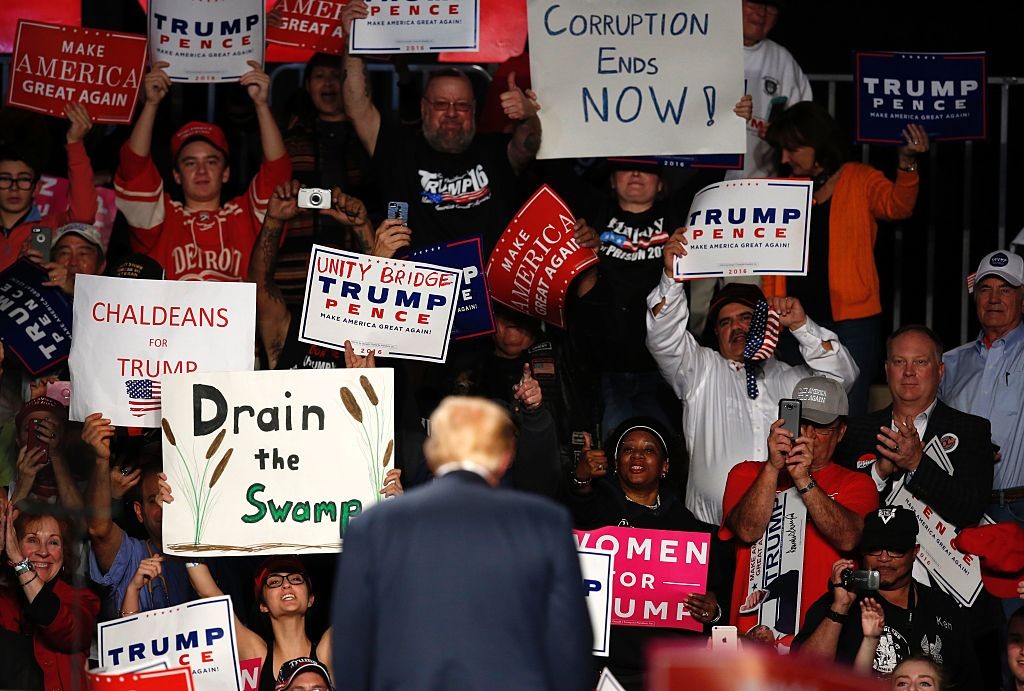 Supporters cheer after US Republican presidential candidate Donald Trump addressed a rally at Macomb Community College on October 31, 2016 in  Warren, Michigan. / AFP / JEFF KOWALSKY        (Photo credit should read JEFF KOWALSKY/AFP/Getty Images)