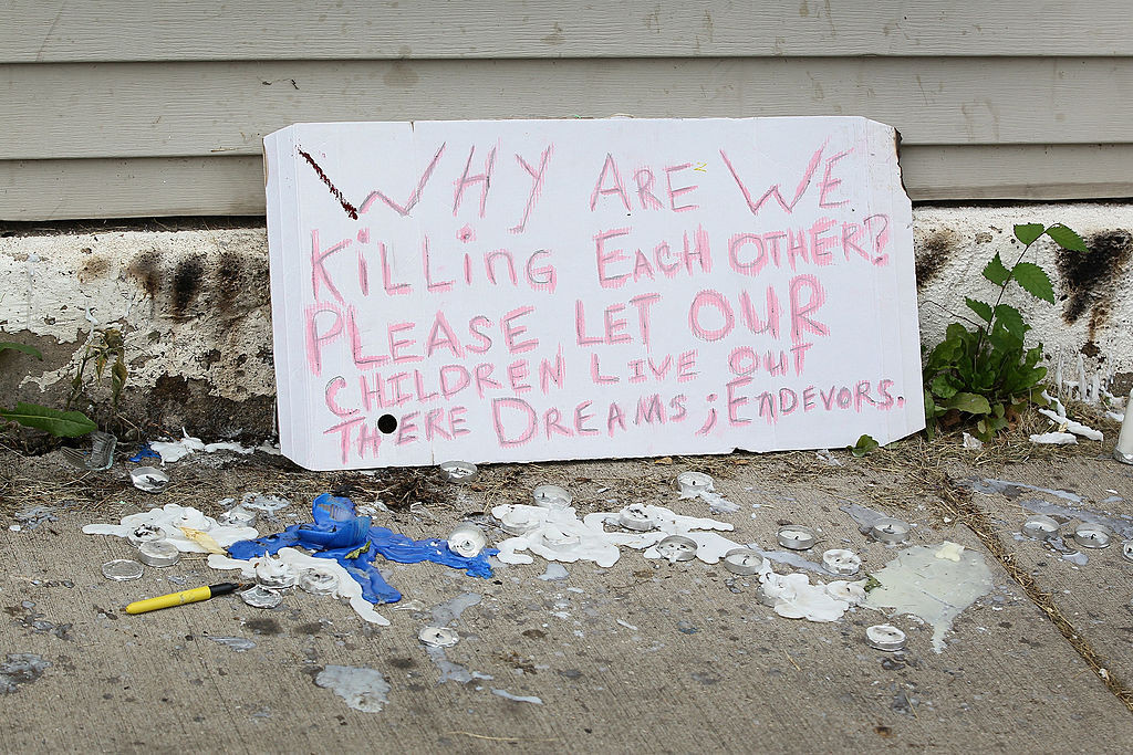 CHICAGO, IL - JULY 20:  A sign from a memorial service for Shamiya Adams on July 20, 2014 in Chicago, Illinois. Adams, 11, was killed  when a stray bullet flew through an open window and struck her in the head.  (Photo by Scott Olson/Getty Images)