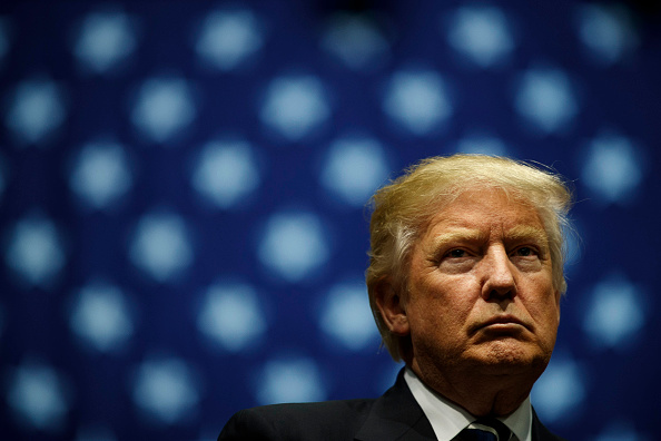 President-elect Donald Trump looks on during a rally at the DeltaPlex Arena, December 9, 2016 in Grand Rapids, Michigan.