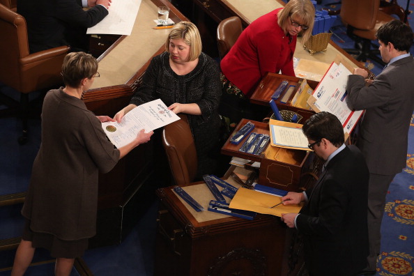Congressional clerks help unseal and organize the Electoral College votes from the 50 states at the U.S. House of Representatives on January 4, 2013. The votes were tallied during a joint session of the 113th Congress. President Barack Obama and Biden received 332 votes to be reelected.  