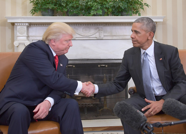 US President Barack Obama shakes hands as he meets with Republican President-elect Donald Trump on transition planning in the Oval Office at the White House. 