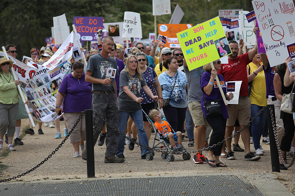 Activists and family members of loved ones who died in the opioid/heroin epidemic march in a "Fed Up!" rally on the National Mall on September 18, 2016 in Washington, DC. 