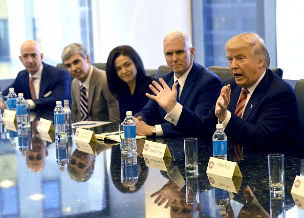 From left, Amazon's chief Jeff Bezos, Larry Page of Alphabet, Facebook COO Sheryl Sandberg, Vice President-elect Mike Pence and President-elect  Donald Trump at Trump Tower on December 14, 2016. Trump is meeting with top tech executives to mend fences after a divisive election in which the majority of Silicon Valley backed Hillary Clinton.  