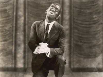  Warner Bros. publicity photo for the film The Jazz Singer (1927), featuring Al Jolson as Jack Robin, in blackface, performing "My Mammy"