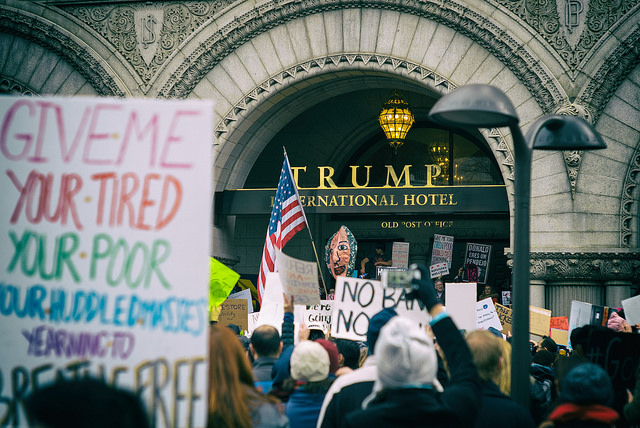 The Trump International Hotel in Washington, DC, has become a popular site of political protest and a symbol of the relationship between the president and the Trump Organization. In January 2017 people gathered to oppose the administration's policies on immigration. 