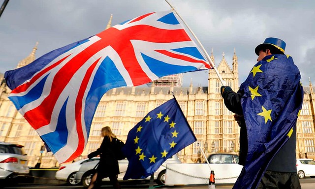 An opponent of Brexit stand in front of Parliament , protesting Britian's plans to leave the European Union.  