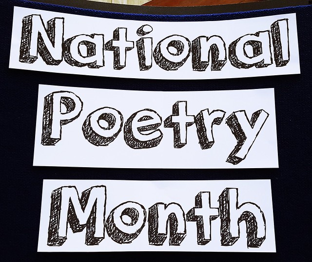 A sign at College of the Mainland Library in Texas  City, Texas, announces April as "National Poetry Month."