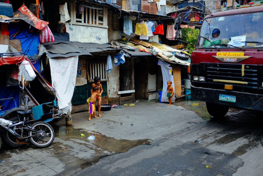Children play in the street in Manila, Philippines. 