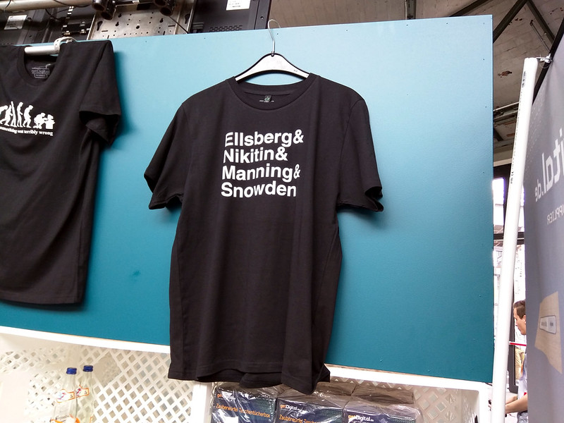 A t-shirt lists the names of well known U.S. whistleblowers. 