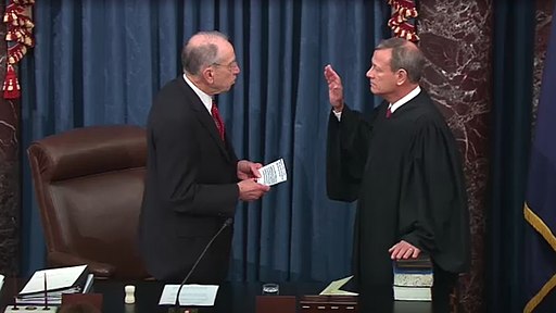 Senator Chuck Grassley administers the oath of office to Chief Justice John Roberts in the opening of the impeachment trial of President Donald Trump.