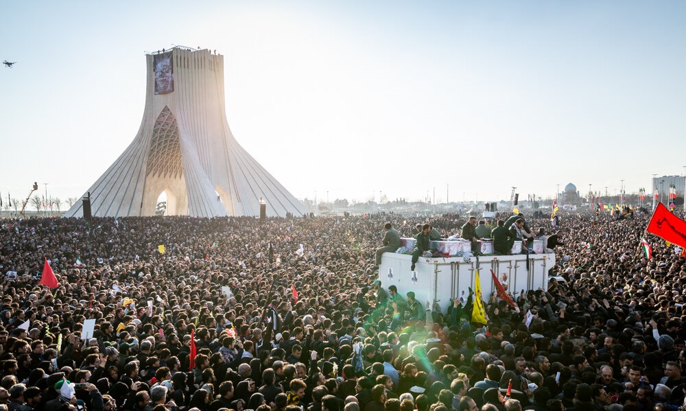 Mourners gather in Tehran at the funeral of slain Iranian general Qasem Soleimani Monday. 