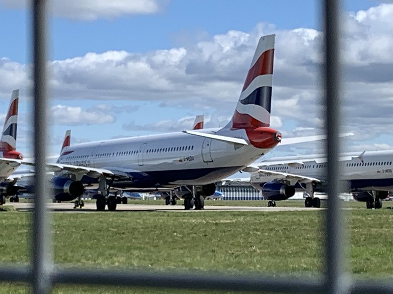 A plane sits on the tarmac. The number of passengers flying has plummeted since shutdowns over Covid-19.