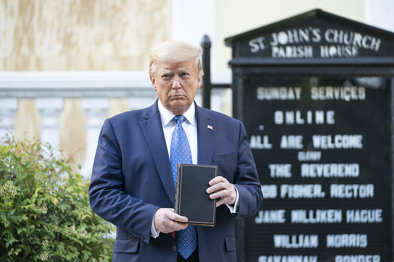 President Trump holds a Bible in front of St. John's Church outside the White House grounds. Peaceful protestors were cleared so he could make the short walk. 