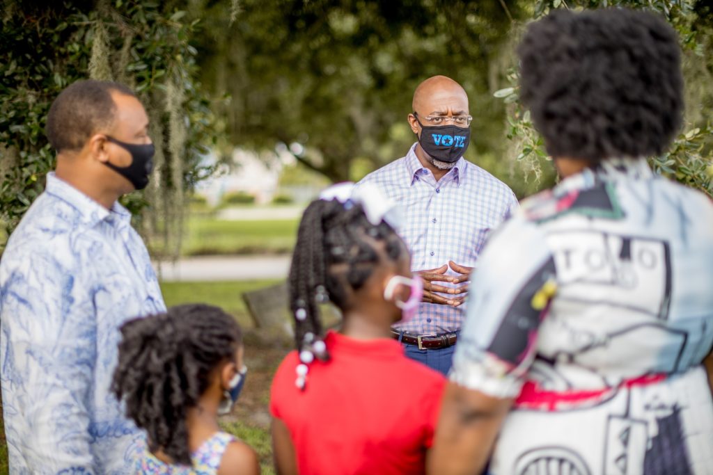 Newly elected senator Raphael Warnock campaigns in Georgia in August 2020. Charles Blow says that Warnock's victory represents the kind of Black political power he argues for in his new book, "The Devil You Know."