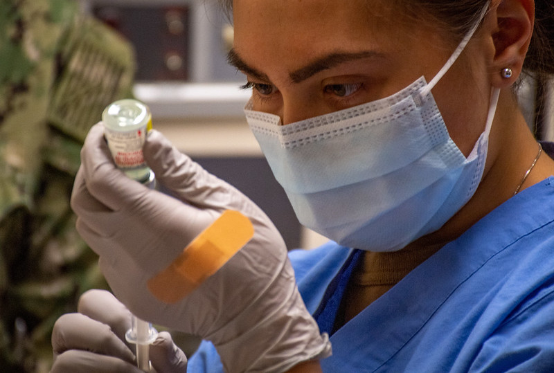 A hospital corpsman prepares a COVID-19 vaccine on December 23, 2020. 