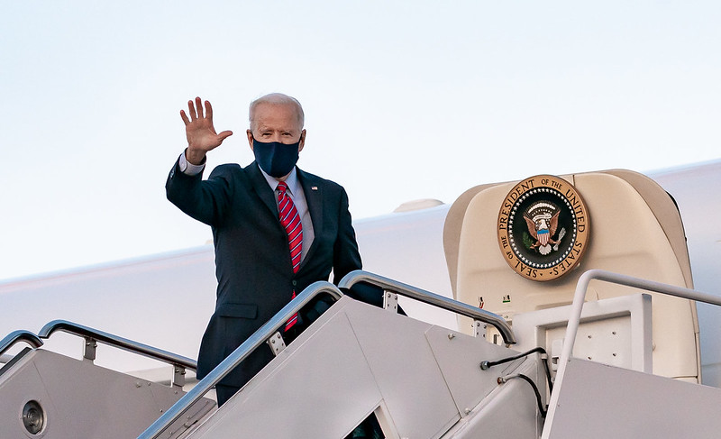 President Joe Biden waves as he boards Air Force One earlier this month.