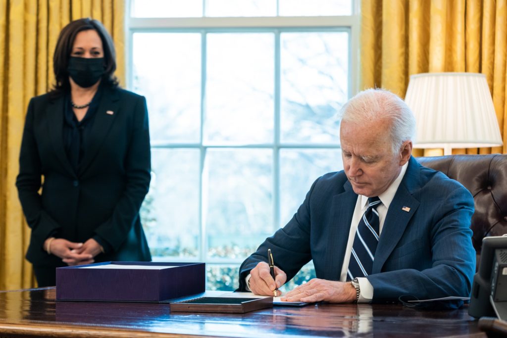 President Joe Biden signs the American Rescue Plan into law on March 11, 2021.