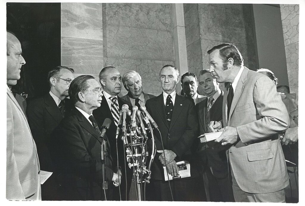 TV newsman Roger Mudd (far right) stands with a group of U.S. Congressmen.