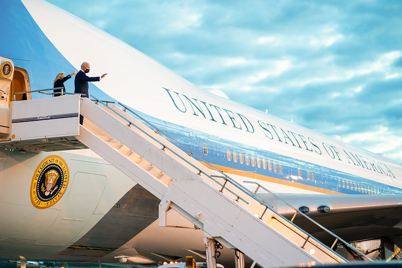 President Biden and First Lady Jill Biden wave as they board Air Force One at Royal Air Force Mildenhall, England on Wednesday, June 9, 2021.