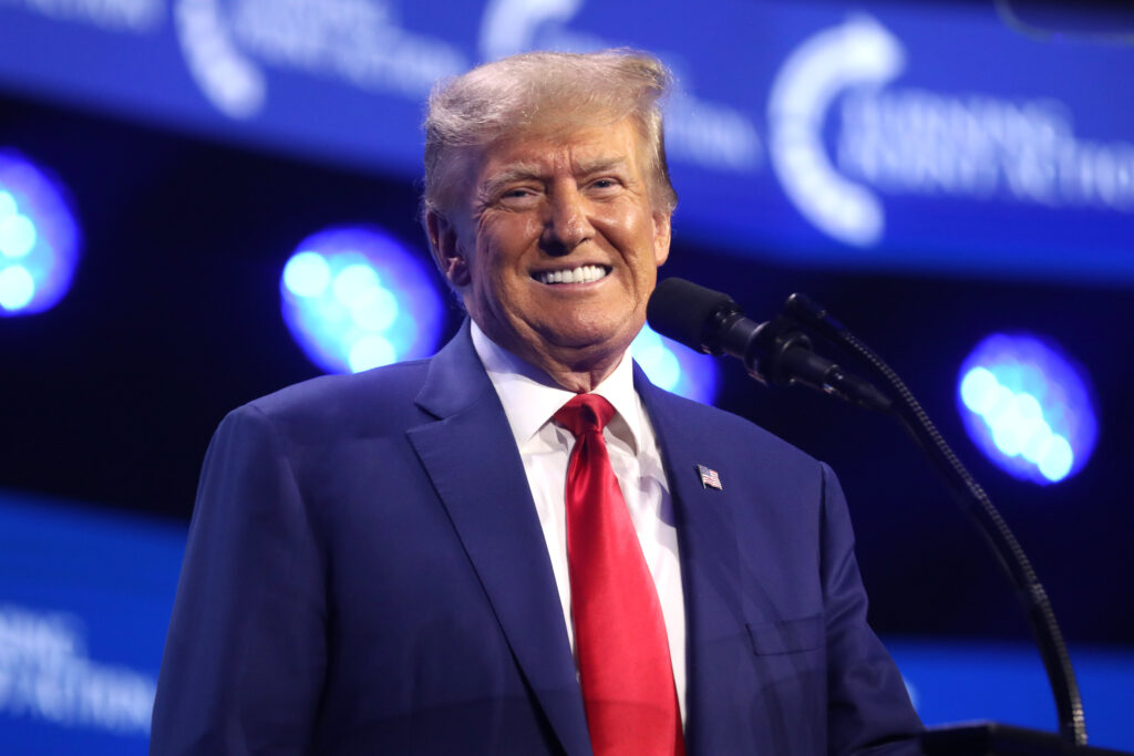 Former President of the United States Donald Trump speaking with attendees at the 2023 Turning Point Action Conference at the Palm Beach County Convention Center in West Palm Beach, Florida.