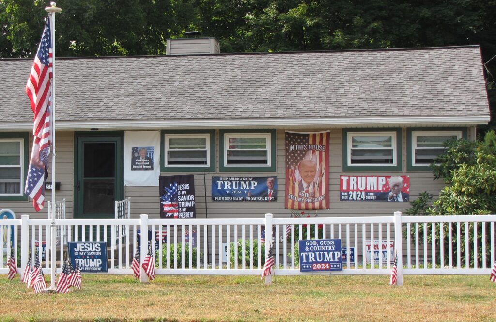 A house in Pennsylvania displays signs in support of Donald Trump's candidacy in 2024, including one that says "JESUS IS MY SAVIOR, TRUMP IS MY PRESIDENT."