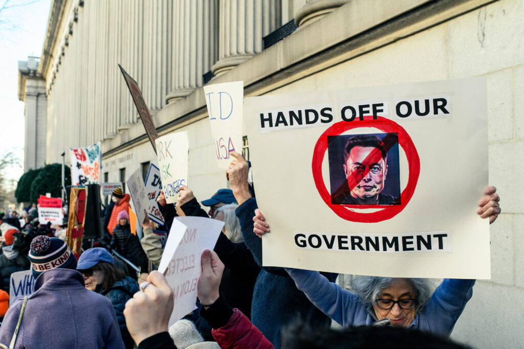 Protesters assembled in front of the Treasury Department this week in response to the administration granting members of DOGE access to a government payment system filled with private and sensitive information. 