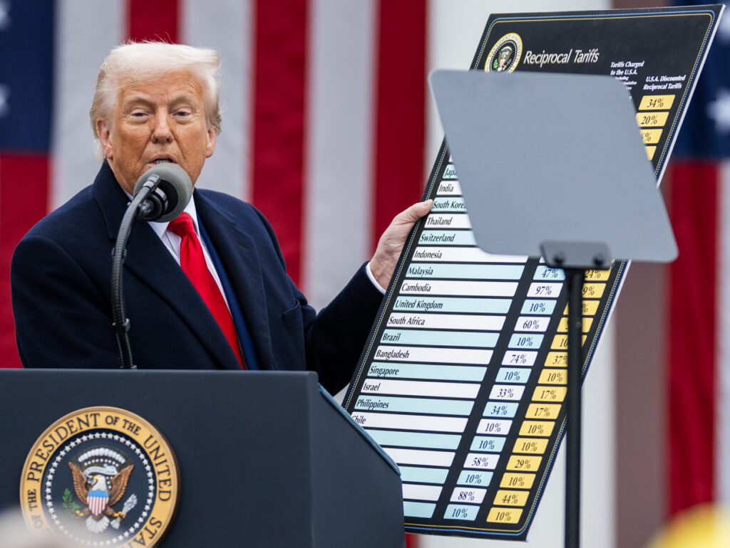 President Donald Trump signs an Executive Order on the Administration’s tariff plans at a “Make America Wealthy Again” event, Wednesday in the White House Rose Garden. 