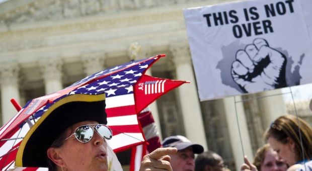Susan Clark argues with another protester about the Affordable Healthcare Act outside the U.S. Supreme Court on June 28, 2012 in Washington, D.C. 