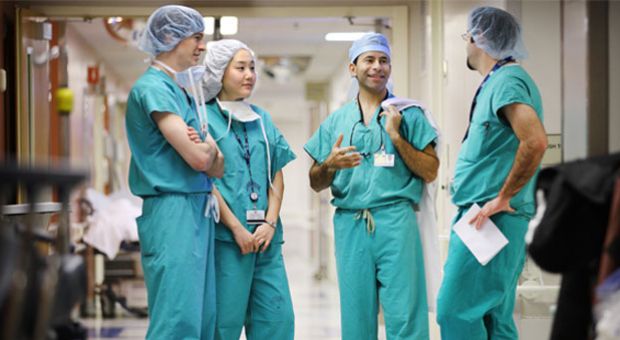 Dr. Marty Makary, third from left, speaks with residents at Johns Hopkins Hospital. 