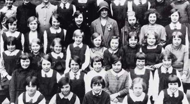 Class photograph of the Junior Class of James Gillespie's Girls' School in 1930. Muriel Spark is second from the right in the third row from the front. The teacher in the middle of the class is Miss Christina Kay, the model for the fictional Miss Jean Brodie. 
