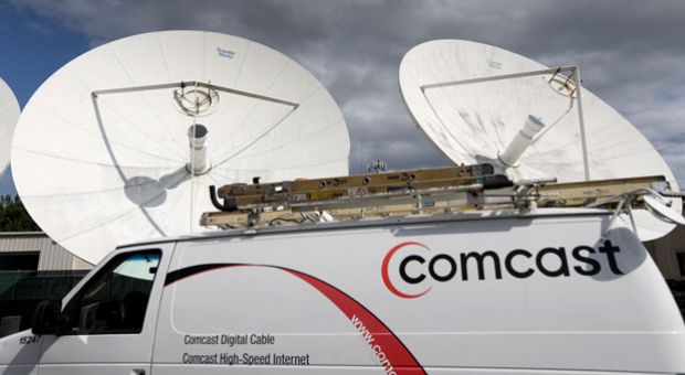 A Comcast truck is seen parked at one of their centers on Feb. 13, 2014 in Pompano Beach, Fla. Comcast announced a $45 billion offer for Time Warner Cable on Feb. 14, 2014. 