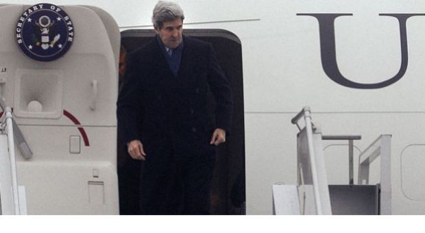 U.S. Secretary of State John Kerry gestures as he arrives at the International Airport in Kiev on March 4, 2014, for talks with Ukraine's interim government, amid an escalating crisis in Crimea. Washington is likely to take steps on sanctions against Russia "later in this week," a U.S. official travelling with Secretary of State John Kerry to Kiev said on March 4. "I think there will be movement on sanctions very likely later in this week and there is a whole spectrum of sanctions," the official said, speaking on condition of anonymity. 