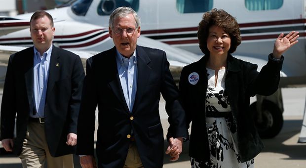 U.S. Senate Republican Leader Sen. Mitch McConnell (R-KY) (C) arrives for a campaign rally with his wife Elaine Chao (R) on May 19, 2014 in Louisville, Kentucky. 