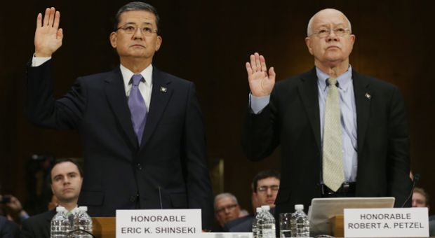 U.S. Veterans Affairs Secretary Eric Shinseki and Veterans Affairs Undersecretary for Health Robert Petzel are sworn in before testifying to the Senate Veterans' Affairs Committee about wait times veterans face to get medical care May 15, 2014 in Washington, DC.  