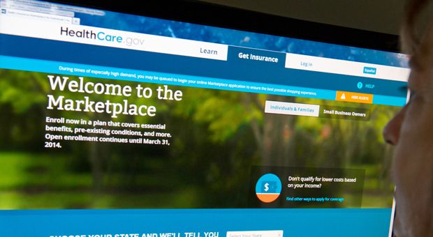 This December 2, 2013 photo shows a woman reading the HealthCare.gov insurance marketplace internet site in Washington, D.C.  This week, two U.S appeals courts issued conflicting rulings on whether millions who buy health insurance on federally run health exchanges can get subsidies. 