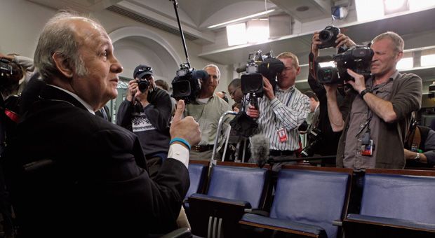 Former White House Press Secretary James Brady gives a thumbs-up to members of the news media while visiting the press briefing room that bears his name in the West Wing of the White House March 30, 2011 in Washington, DC. Brady was visiting the White House on the 30th anniversary of the day he was shot in the head by John Hinckley, Jr., during his attempted assassination of former President Ronald Reagan.