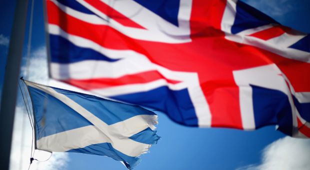 A Union Jack and Saltire flags blow in the wind near to Glen Coe on March 24, 2014 in Glen Coe, Scotland. A referendum on whether Scotland should be an independent country will take place on September 18, 2014.  