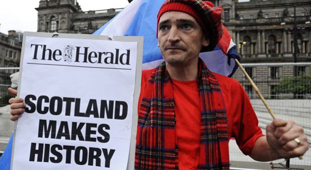 A pro-independence supporter is pictured in George Square in Glasgow, Scotland, on September 19, 2014, following a defeat in the referendum on Scottish independence. Scotland rejected independence on Friday in a referendum that left the centuries-old United Kingdom intact but paved the way for a major transfer of powers away from London. 