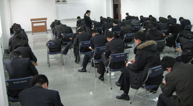Suki Kim and her students take a final exam at a school in North Korea, December 2011.