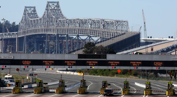 A California Highway Patrol officer guards the closed toll plaza leading to the San Francisco Bay Bridge October 28, 2009 in Oakland, California. 